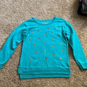 Teal sweater with gold hearts